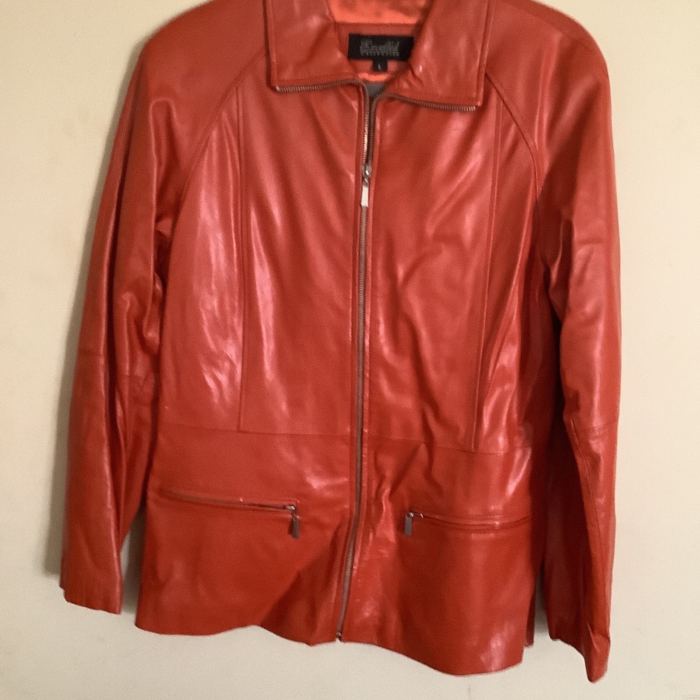 Excelled Collection burnt orange leather jacket with zipper pockets. Size large.